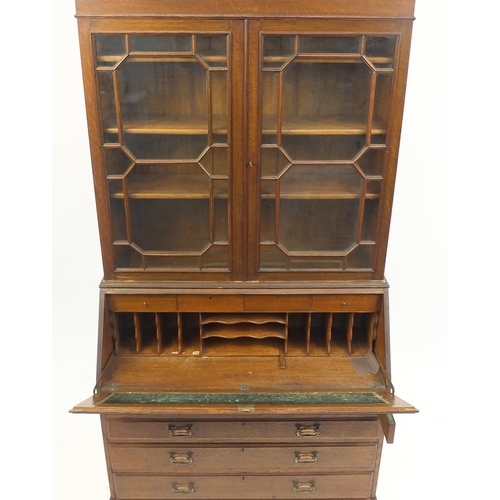 22 - Oak bureau bookcase with swan neck pediment, 226cm H x 107cm W x 48cm D