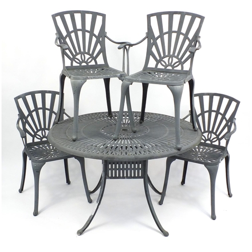 75 - Circular cast aluminium garden table and four chairs, the table 73cm high x 122cm in diameter