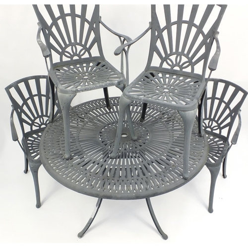 75 - Circular cast aluminium garden table and four chairs, the table 73cm high x 122cm in diameter