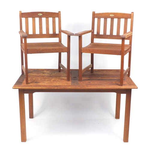 39 - Rectangular teak garden table and two chairs, the table 76cm H x 150cm W x 90cm D