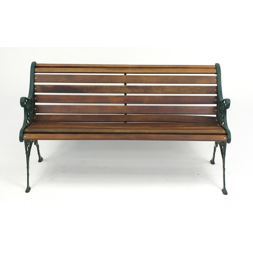 79 - Cast iron and teak garden bench, 71cm H x 127cm W x 58cm D