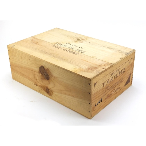 2066 - Twelve bottles of 2001 Chateau Tour de Pez Saint-Estephe housed in a sealed crate.