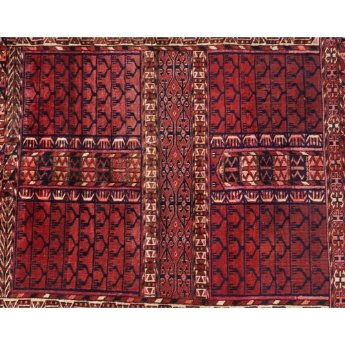 2076 - Turkman rug with all over blue and red geometric design, 140cm x 130cm