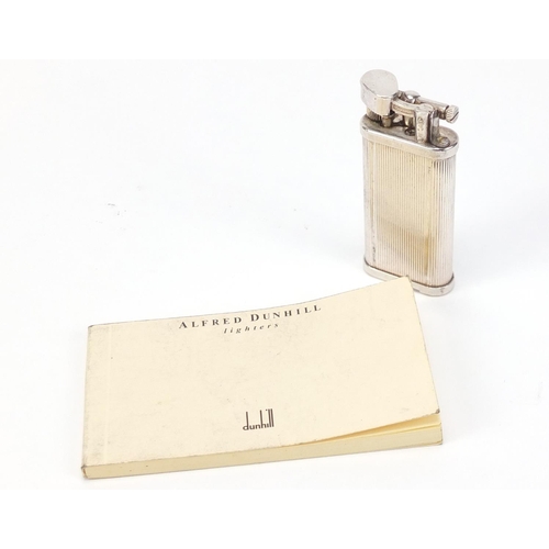 2478 - Alfred Dunhill silver plated pocket lighter with booklet, 6.5cm high