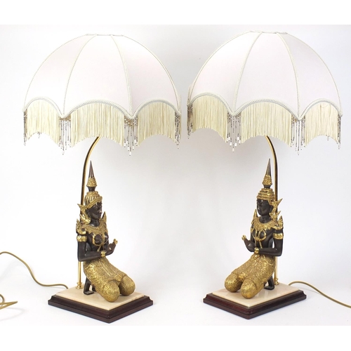 2063 - Pair of gilt bronze Thai buddha design table lamps with shades, overall 80cm high