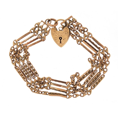 2520 - 9ct gold four row gate bracelet with love heart shaped padlock, 19.8g