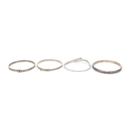 2572 - Four silver bangles, one set with colourful stones, 70.4g