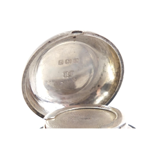 2549 - Silver sovereign case, engraved with leaves,  Birmingham 1913, 3cm in diameter, 22.4g