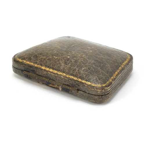 2605 - Vintage Asprey tooled leather jewel box, housing a gilt metal brooch