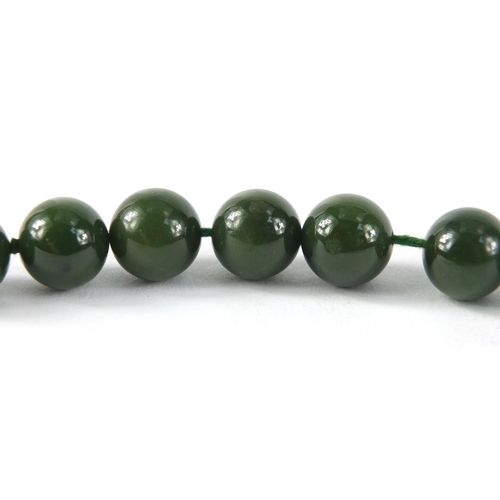 2612A - Chinese green jade bead necklace with 18ct gold clasp, 46cm in length