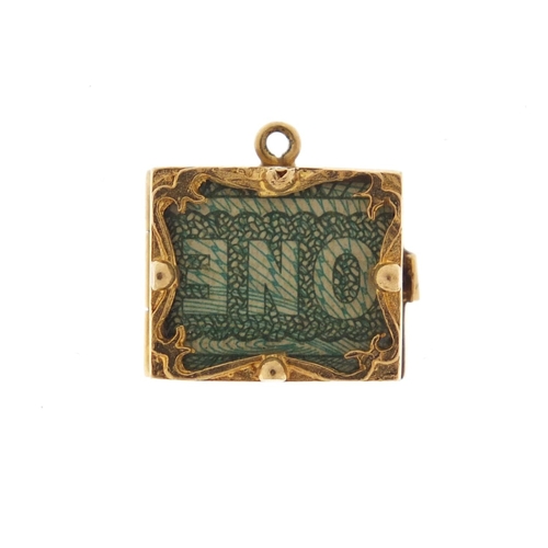 2612 - 9ct gold emergency one pound note charm, 1.5cm in length, 3.3g