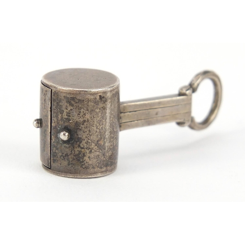 2611 - Novelty unmarked silver magnifying glass in the form of a mallet, 3.5cm in length, 10.6g