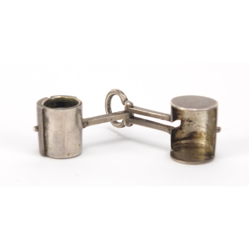 2611 - Novelty unmarked silver magnifying glass in the form of a mallet, 3.5cm in length, 10.6g