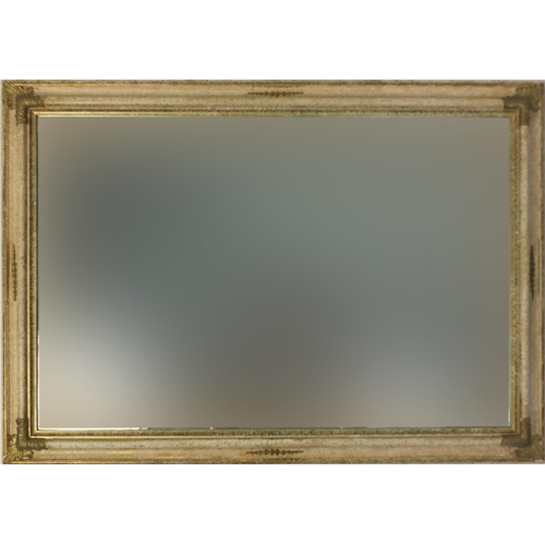 18 - Large cream and gilt framed mirror with bevelled glass, 103cm x 73cm