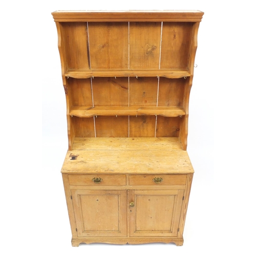 49 - Pine dresser with open plate rack above two drawers and a pair of cupboard doors, 181cm H x 94cm W x... 