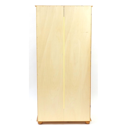 57 - Pine two door wardrobe with a drawer to the base, 186cm H x 84cm W x 55cm D