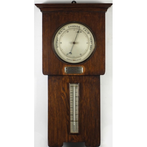 2093 - Art Deco oak wall aneroid barometer and thermometer with an applied silver plaque with presentation ... 