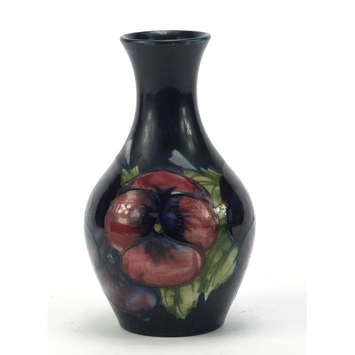 610 - Moorcroft pottery vase, hand painted with flowers, painted and impressed marks to the base, 14.5cm h... 