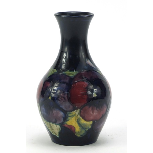 610 - Moorcroft pottery vase, hand painted with flowers, painted and impressed marks to the base, 14.5cm h... 