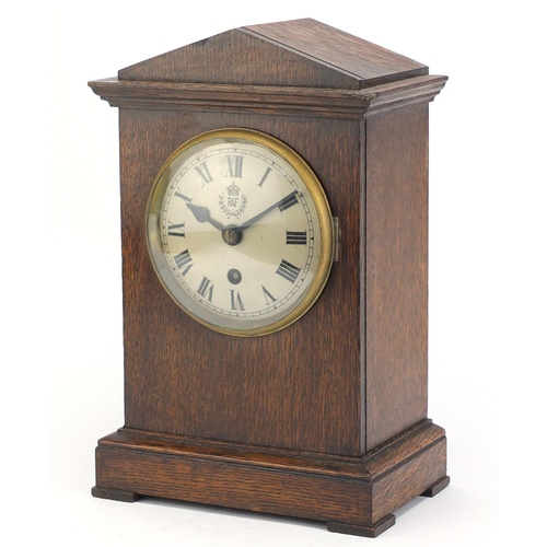 87 - British military World War II RAF Officer's mess clock housed in an oak case, the movement stamped S... 