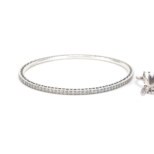 2604 - Pandora silver cubic zirconia bangle and three rings, 2.4g