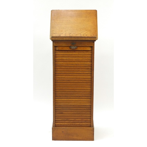 2037 - 1920's oak filing cabinet with tambour front with easel top, 116cm H x 49cm W x 42cm D