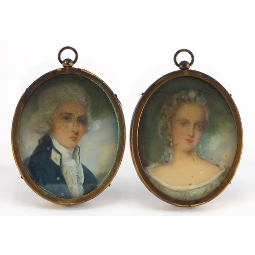 2501 - Pair of oval hand painted portrait miniatures including a man in formal dress, framed, each overall ... 