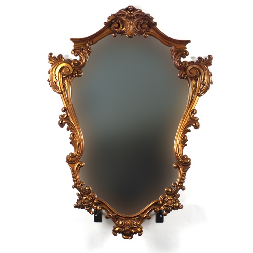 24 - Gilt framed cartouche shaped mirror, 74cm x 54cm