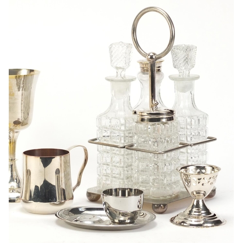 2301 - Silverplate and a silver christening tankard including a four bottle cruet on stand