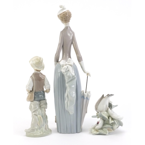 2294 - Lladro including large figurine with a Corgi and a figure of a young boy, the largest 37cm high