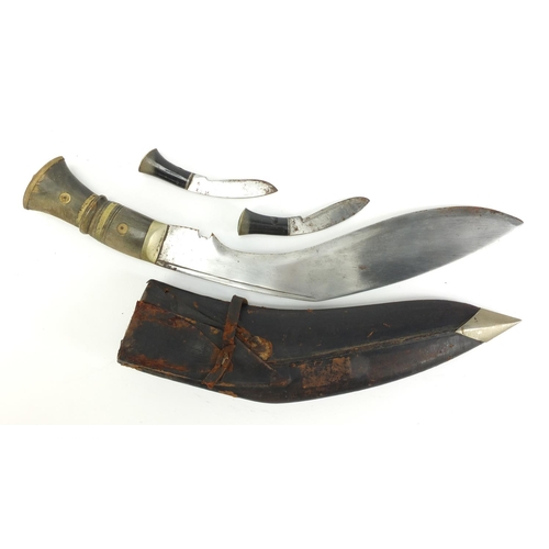 2948 - Kukri knife with leather sheath and horn handles, 44cm in length