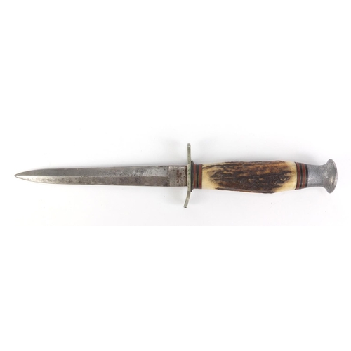 2893 - Military interest Commando knife with bone handle, the leather sheaf with Royal Sussex Regiment insi... 