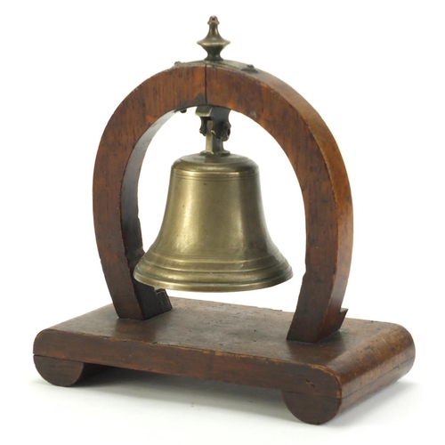 2891 - Oak and brass horseshoe design table bell, 22cm high