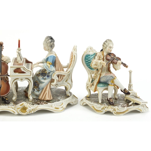 2193 - Three hand painted Dresden Kunst musician figure groups, the largest 26cm wide