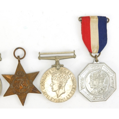 2882 - Three British military World War II medals and two 1935 silver jubilee medallions