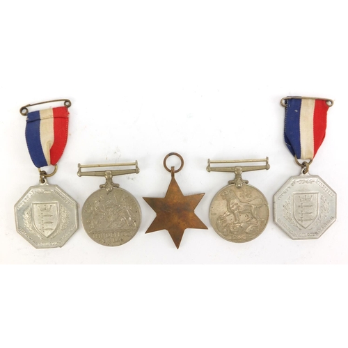 2882 - Three British military World War II medals and two 1935 silver jubilee medallions