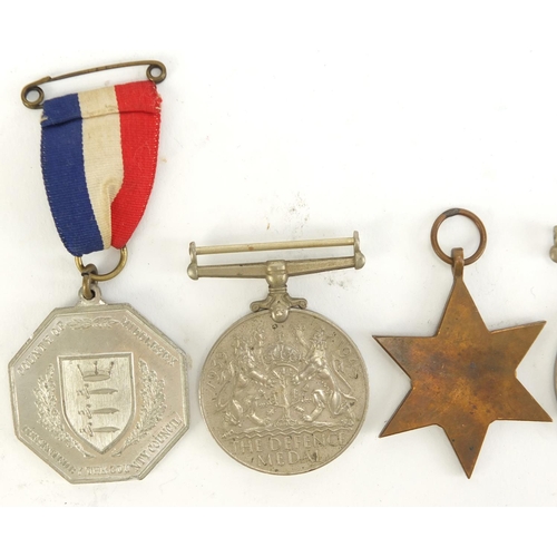 2882 - Three British military World War II medals and two 1935 silver jubilee medallions