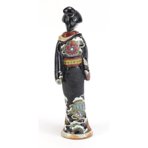 75 - Japanese porcelain figurine of a Geisha girl wearing a robe, 29cm high