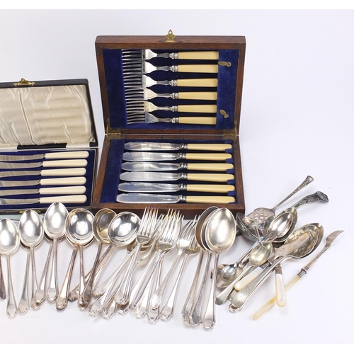 2344 - Mostly silver plated cutlery including a set of six fish knives and forks housed in an oak canteen