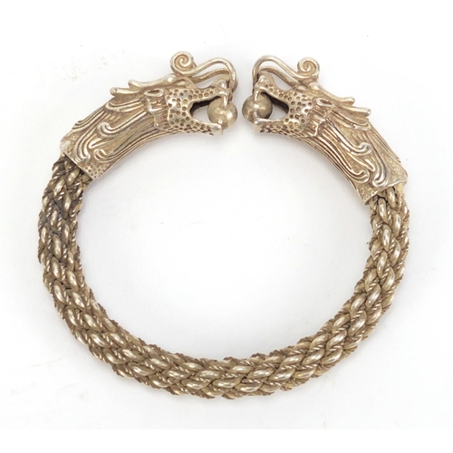 2879 - Chinese silver coloured metal dragon bracelet, 9.5cm wide