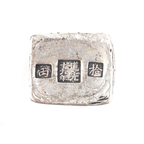 2945 - Chinese silver coloured metal scroll weight, 6cm wide