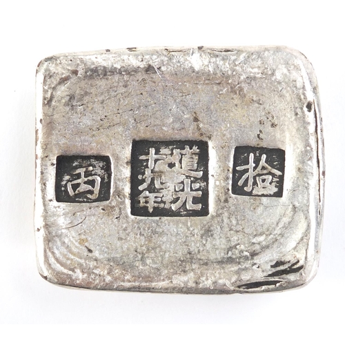 2945 - Chinese silver coloured metal scroll weight, 6cm wide