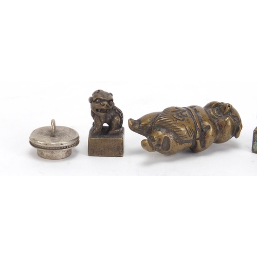 2881 - Chinese metalware including three miniature foo dog seals the largest 4.3cm high