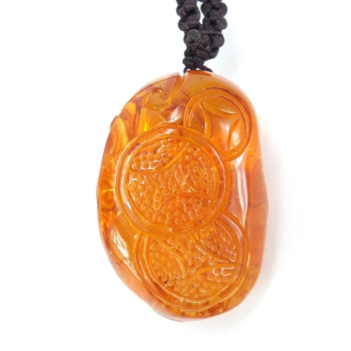 2923 - Chinese natural amber pendant carved with a squirrel, 4.5cm high