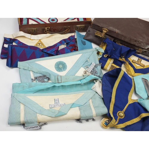 2898 - Masonic regalia including aprons and jewels housed in two brown leather cases