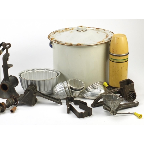 2598 - Vintage kitchenalia including two enamelled flour bins and covers, mincers and jelly moulds