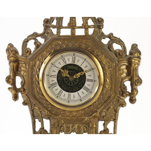 2213 - Ornate brass mantel clock mounted with two figures, 36cm high