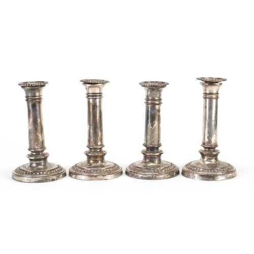 2251 - Set of four silver plated candlesticks, each 17cm high