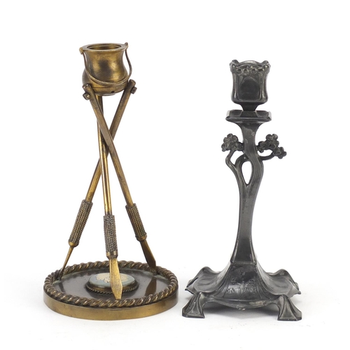 2799 - Art Nouveau pewter candlestick and one other in the form of a cauldron being supported by three arro... 