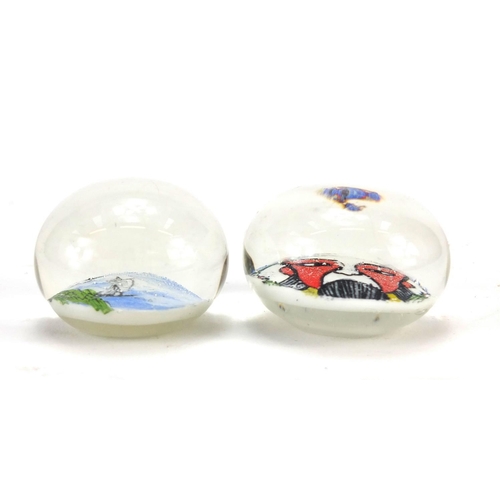 3016 - Two glass paperweights including one decorated with a Chinese Emperor, the largest 4.7cm in diameter